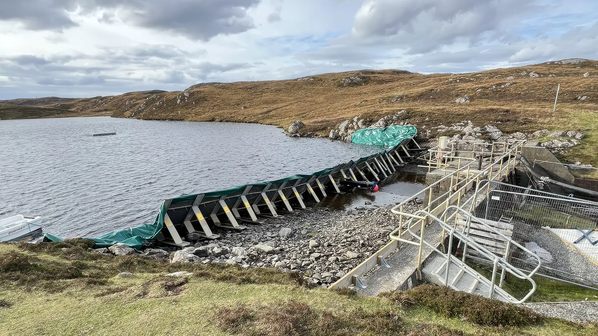 Frame dam providing temporary water control at a reservoir for inspection and maintenance works.