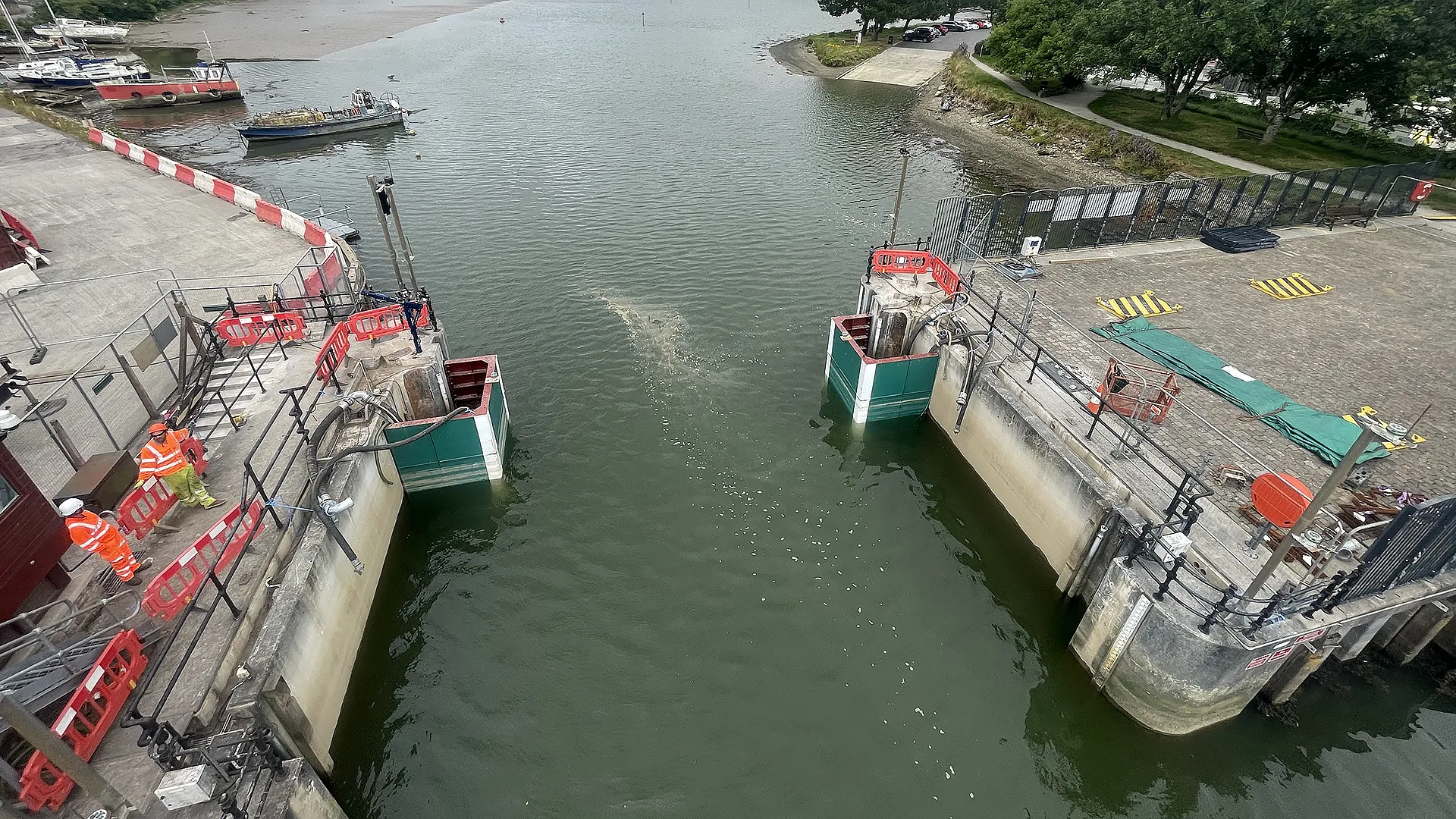 Elevated view of two limpet dams installed against opposing concrete water control structures
