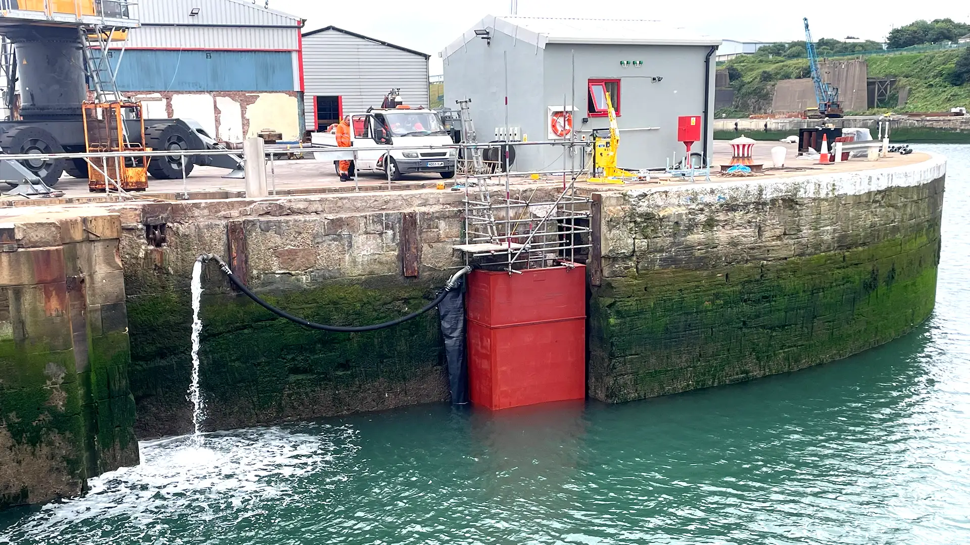 High Water Limpet Dam installed within a harbour to isolate a marine structure for inspection and maintenance works.