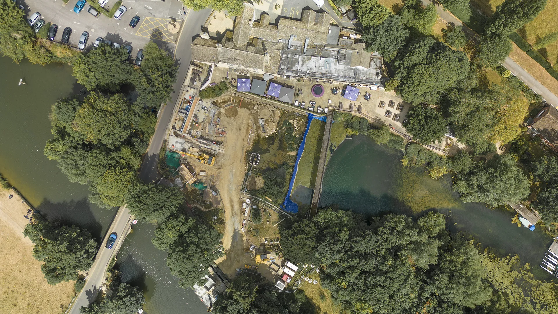 Aerial view of a temporary flow diversion system installed to maintain water flow during engineering works.