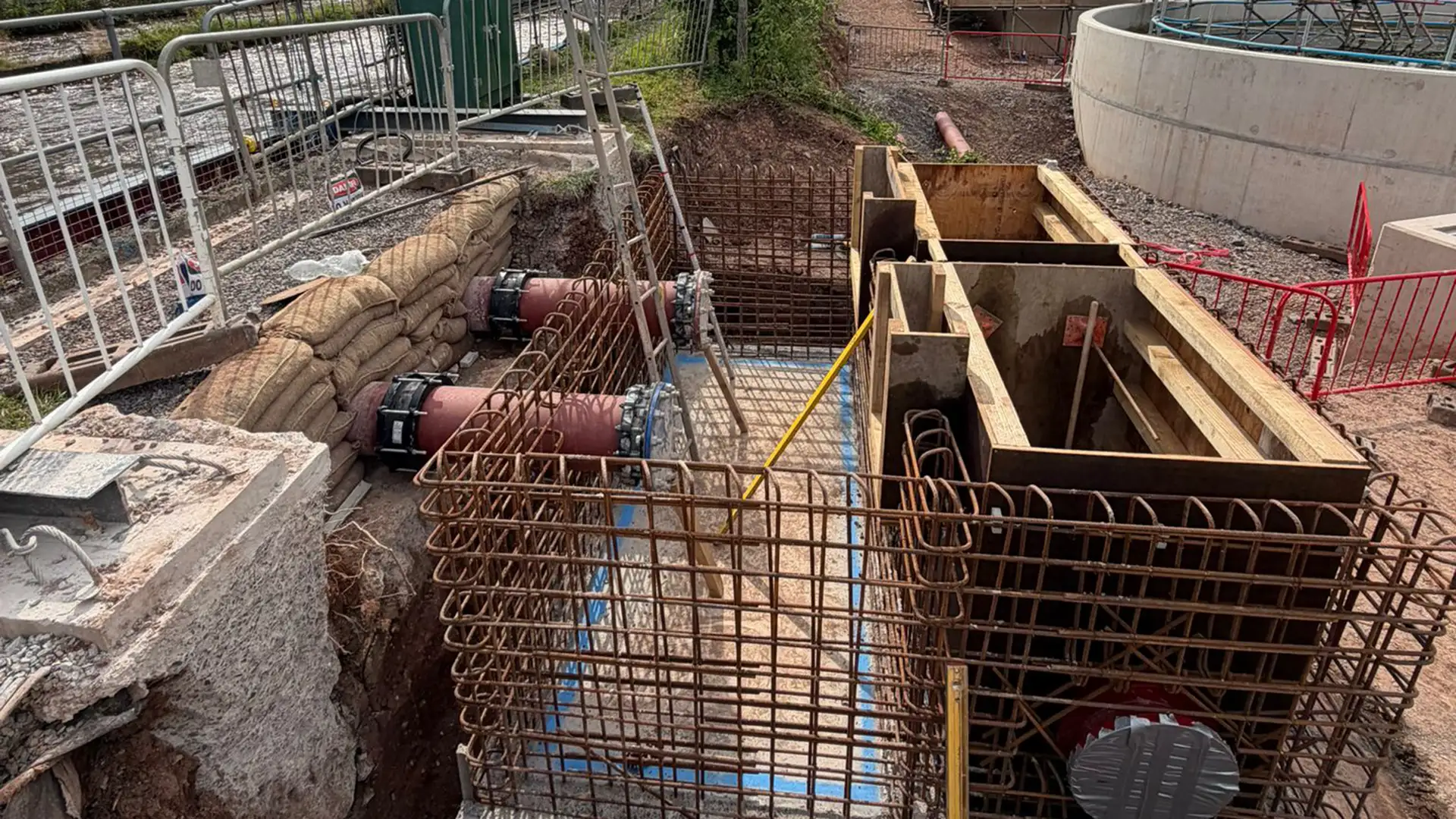 Temporary pipeline diversion installed at a water treatment facility during infrastructure upgrade works.