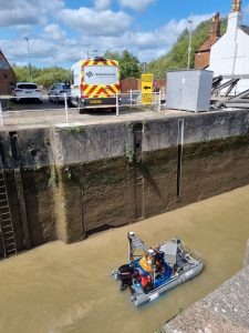 High Water team surveying lock